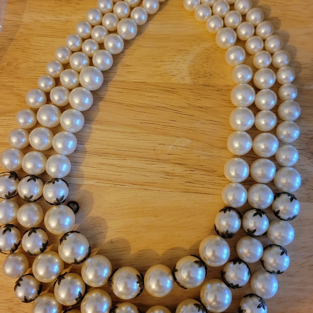 This three ring strand of pearls and earrings is a lot of pearls and incredible.
